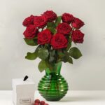 10 Röda rosor med lakritskulor